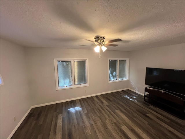 1159 E Winged Foot Cir, Winter Springs, FL 32708 - unfurnished living room with a textured ceiling, dark wood-type flooring, and a ceiling fan