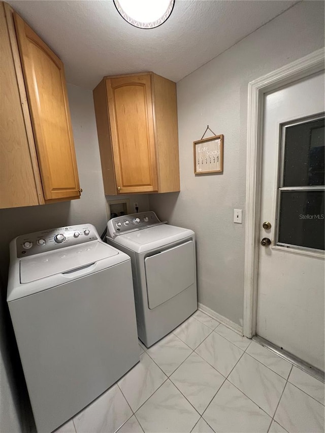 1159 E Winged Foot Cir, Winter Springs, FL 32708 - laundry area featuring cabinet space, washing machine and dryer, light marble finish floors, and a textured ceiling