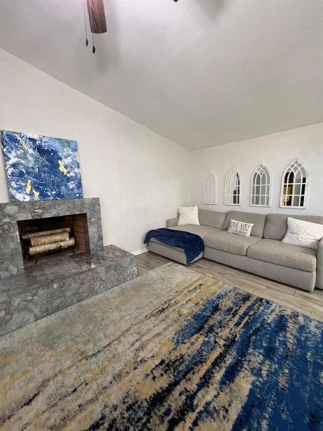 1159 E Winged Foot Cir, Winter Springs, FL 32708 - living room featuring wood finished floors, a ceiling fan, and a premium fireplace