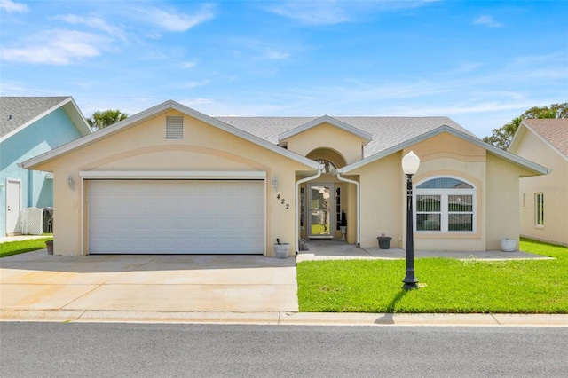 422 Harbourview Dr, Haines City, FL 33844 - ranch-style house featuring an attached garage, concrete driveway, stucco siding, and a front yard