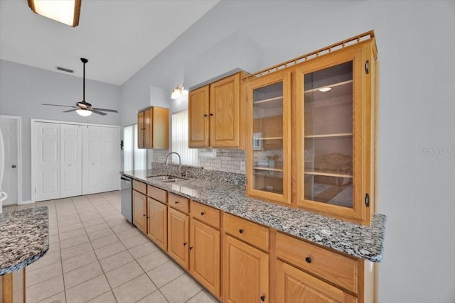 422 Harbourview Dr, Haines City, FL 33844 - kitchen featuring light tile patterned floors, light stone counters, stainless steel dishwasher, a ceiling fan, and glass insert cabinets