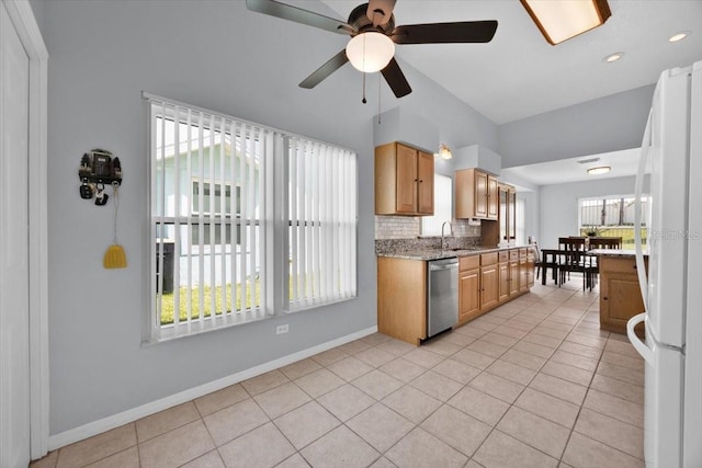 422 Harbourview Dr, Haines City, FL 33844 - kitchen featuring freestanding refrigerator, light tile patterned floors, ceiling fan, and dishwasher
