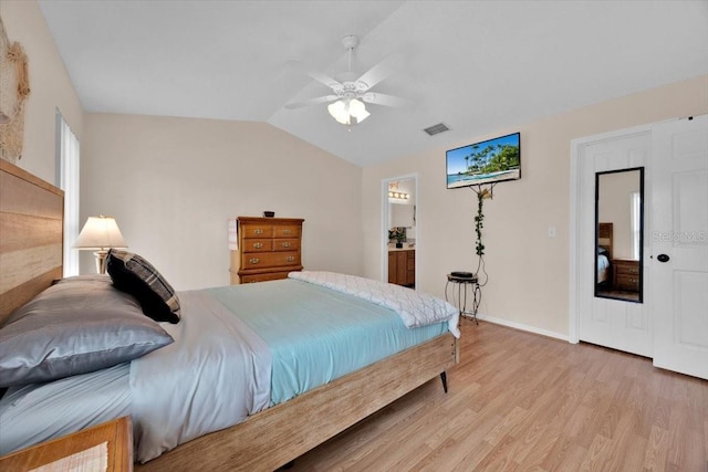 422 Harbourview Dr, Haines City, FL 33844 - bedroom featuring light wood finished floors, lofted ceiling, and a ceiling fan