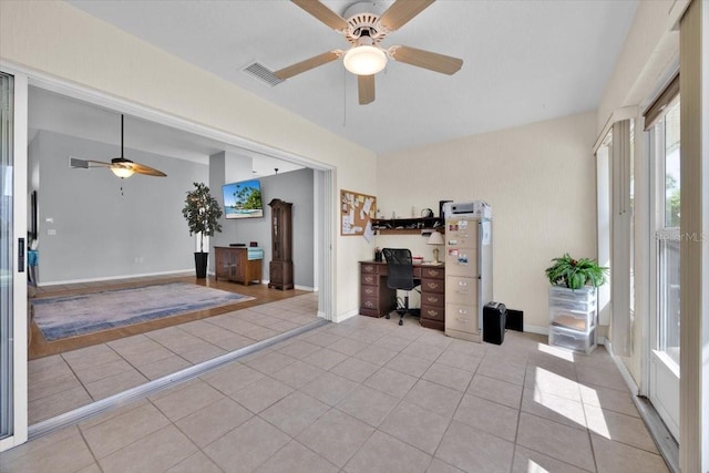 422 Harbourview Dr, Haines City, FL 33844 - tiled home office with a ceiling fan and baseboards