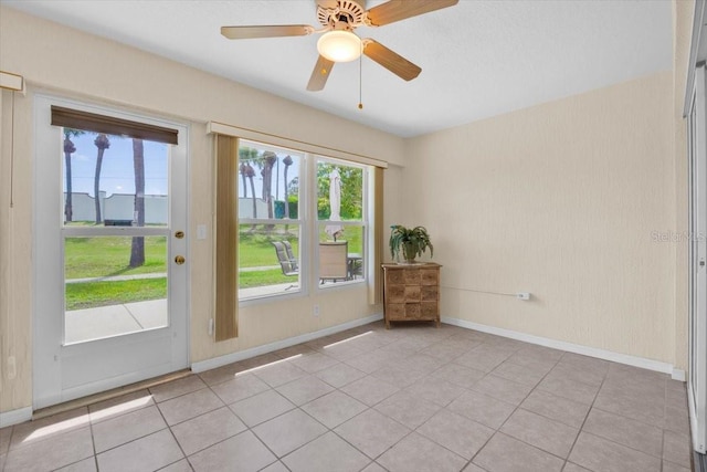 422 Harbourview Dr, Haines City, FL 33844 - unfurnished room featuring plenty of natural light, light tile patterned flooring, and a ceiling fan
