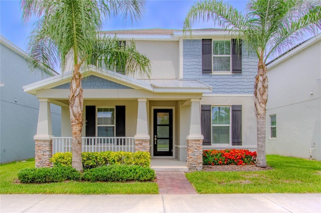 7524 Summerlake Groves St, Winter Garden, FL 34787 - craftsman house featuring stucco siding, covered porch, and stone siding