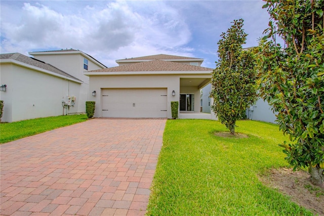7524 Summerlake Groves St, Winter Garden, FL 34787 - view of front of house with decorative driveway, a front yard, a garage, stucco siding, and roof with shingles
