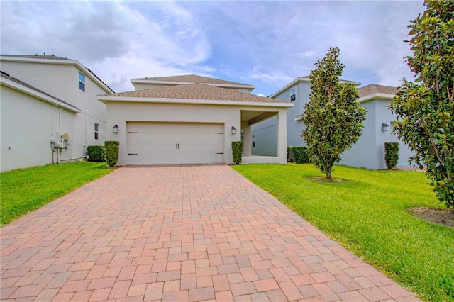 7524 Summerlake Groves St, Winter Garden, FL 34787 - view of front of home featuring decorative driveway, a front lawn, a garage, and stucco siding