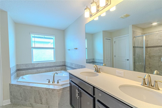 7524 Summerlake Groves St, Winter Garden, FL 34787 - full bathroom featuring a bath, double vanity, a shower stall, and a textured ceiling