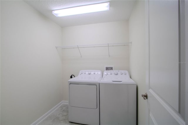 7524 Summerlake Groves St, Winter Garden, FL 34787 - laundry area featuring washer and dryer and light tile patterned floors