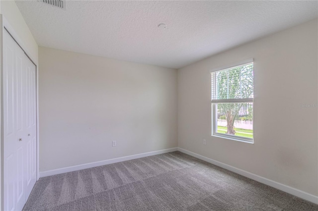 7524 Summerlake Groves St, Winter Garden, FL 34787 - carpeted empty room featuring baseboards and a textured ceiling