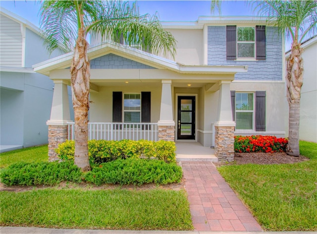 7524 Summerlake Groves St, Winter Garden, FL 34787 - view of front of house with stucco siding and covered porch