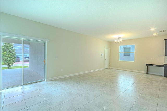 7524 Summerlake Groves St, Winter Garden, FL 34787 - empty room featuring a chandelier and light tile patterned floors