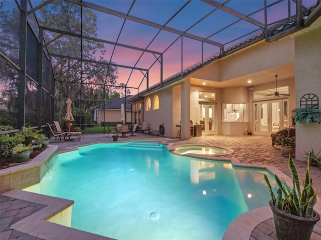8974 Grey Hawk Pt, Orlando, FL 32836 - view of swimming pool with french doors, a patio, a pool with connected hot tub, and a ceiling fan