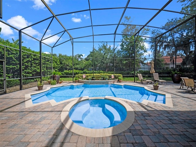 8974 Grey Hawk Pt, Orlando, FL 32836 - view of swimming pool featuring a pool with connected hot tub, a patio, and a lanai