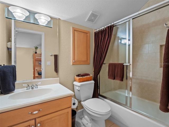 8974 Grey Hawk Pt, Orlando, FL 32836 - bathroom with shower / bath combination with glass door, vanity, tile patterned floors, and a textured ceiling