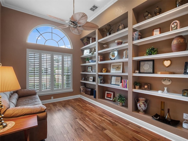 8974 Grey Hawk Pt, Orlando, FL 32836 - living area featuring crown molding, a ceiling fan, and wood finished floors