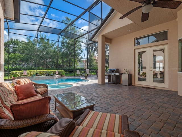 8974 Grey Hawk Pt, Orlando, FL 32836 - view of patio featuring french doors, area for grilling, an outdoor pool, a jacuzzi, and a ceiling fan