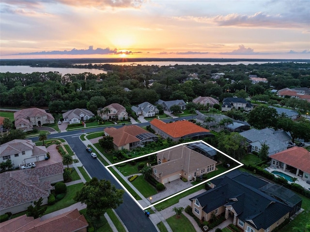 8974 Grey Hawk Pt, Orlando, FL 32836 - aerial perspective of suburban area with a large body of water and property parcel outlined