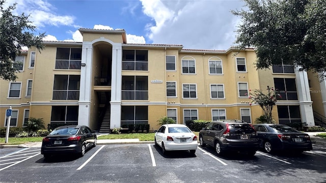 1375 Lake Shadow Cir Unit 11203, Maitland, FL 32751 - view of property featuring uncovered parking and stairway