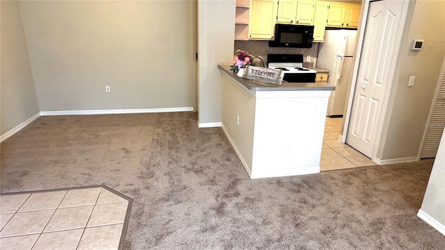 1375 Lake Shadow Cir Unit 11203, Maitland, FL 32751 - kitchen featuring white appliances, light colored carpet, light tile patterned floors, tasteful backsplash, and a peninsula