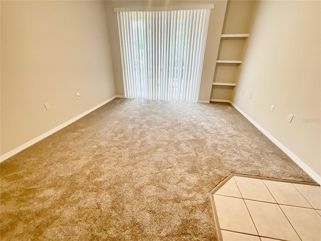1375 Lake Shadow Cir Unit 11203, Maitland, FL 32751 - carpeted empty room with built in shelves and baseboards