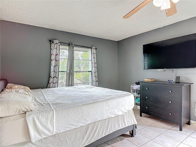 1510 Chatsworth Ave, Deltona, FL 32738 - bedroom featuring light tile patterned floors, a textured ceiling, and ceiling fan