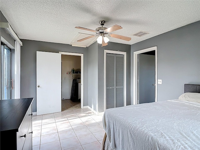 1510 Chatsworth Ave, Deltona, FL 32738 - bedroom featuring light tile patterned flooring, a closet, a ceiling fan, and a textured ceiling