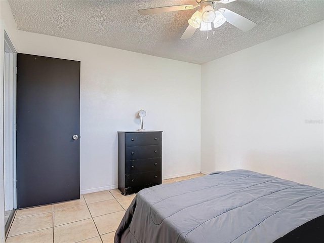 1510 Chatsworth Ave, Deltona, FL 32738 - bedroom featuring a textured ceiling, light tile patterned flooring, and a ceiling fan