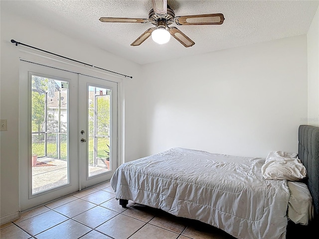 1510 Chatsworth Ave, Deltona, FL 32738 - bedroom with access to exterior, light tile patterned floors, french doors, a textured ceiling, and a ceiling fan