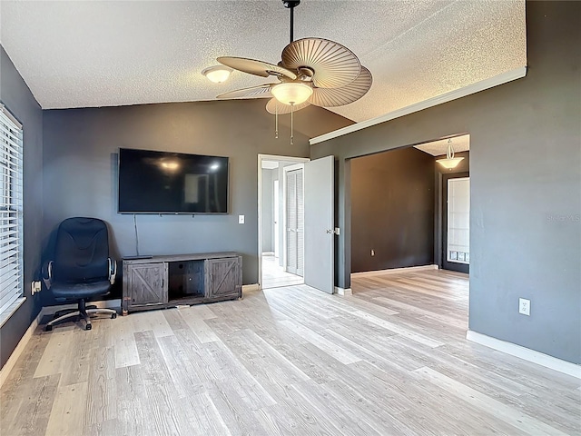 1510 Chatsworth Ave, Deltona, FL 32738 - living room featuring a textured ceiling, lofted ceiling, wood finished floors, and a ceiling fan