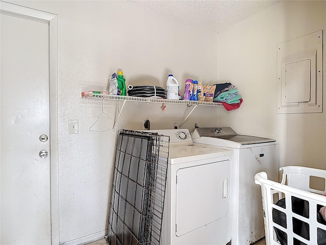 1510 Chatsworth Ave, Deltona, FL 32738 - laundry room with washing machine and dryer, electric panel, and a textured ceiling