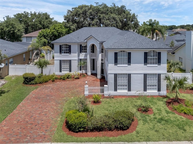 1121 Needlewood Loop, Oviedo, FL 32765 - view of front facade featuring stucco siding and roof with shingles