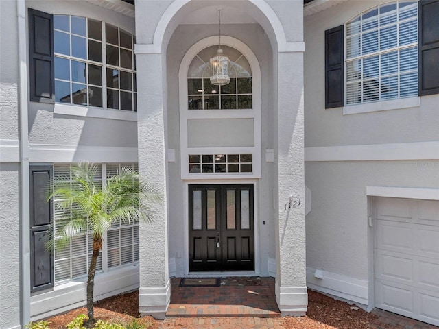1121 Needlewood Loop, Oviedo, FL 32765 - doorway to property with stucco siding