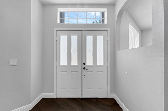 1121 Needlewood Loop, Oviedo, FL 32765 - foyer with dark wood finished floors and arched walkways