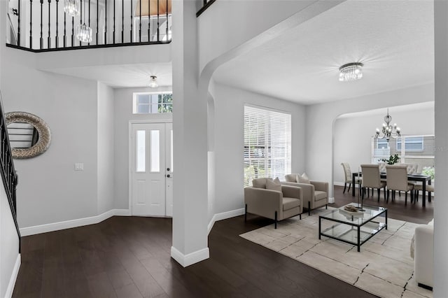 1121 Needlewood Loop, Oviedo, FL 32765 - entryway featuring a chandelier, wood finished floors, healthy amount of natural light, and a high ceiling