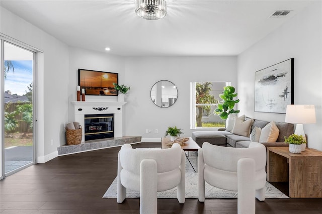 1121 Needlewood Loop, Oviedo, FL 32765 - living room with a glass covered fireplace, dark wood-style flooring, and recessed lighting