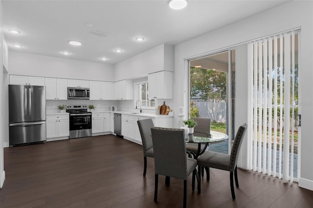 1121 Needlewood Loop, Oviedo, FL 32765 - dining area with dark wood finished floors and recessed lighting