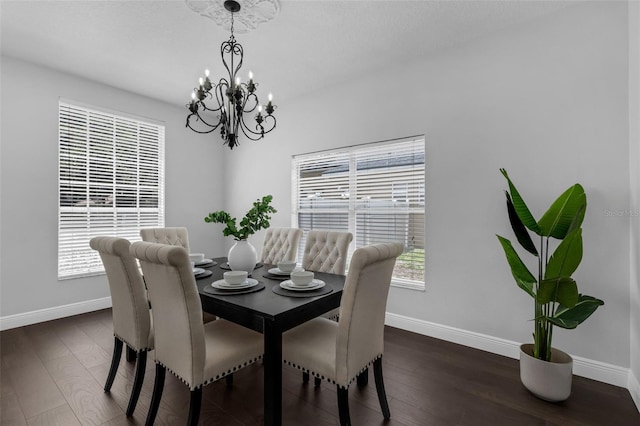1121 Needlewood Loop, Oviedo, FL 32765 - dining area featuring a chandelier and dark wood-style floors