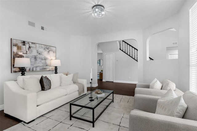 1121 Needlewood Loop, Oviedo, FL 32765 - living room featuring arched walkways and stairway