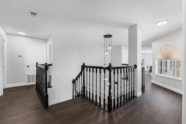 1121 Needlewood Loop, Oviedo, FL 32765 - corridor featuring an upstairs landing and dark wood-style flooring