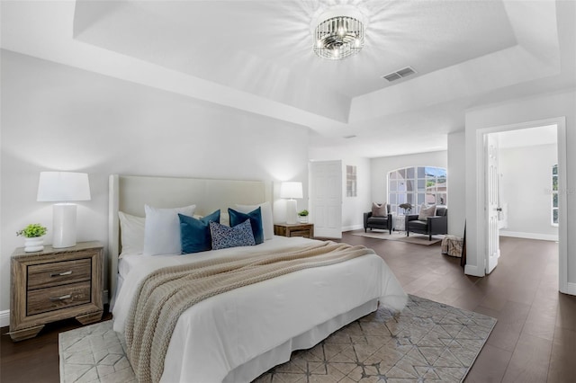 1121 Needlewood Loop, Oviedo, FL 32765 - bedroom featuring a raised ceiling and wood finished floors