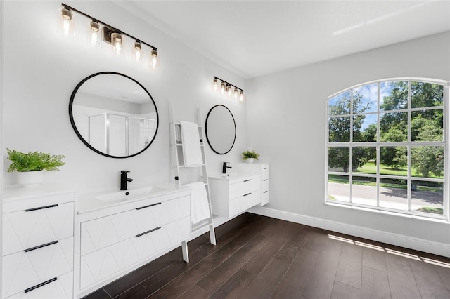 1121 Needlewood Loop, Oviedo, FL 32765 - bathroom with two vanities and wood finished floors