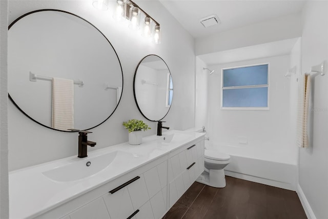 1121 Needlewood Loop, Oviedo, FL 32765 - full bath featuring double vanity, bathing tub / shower combination, and wood finished floors
