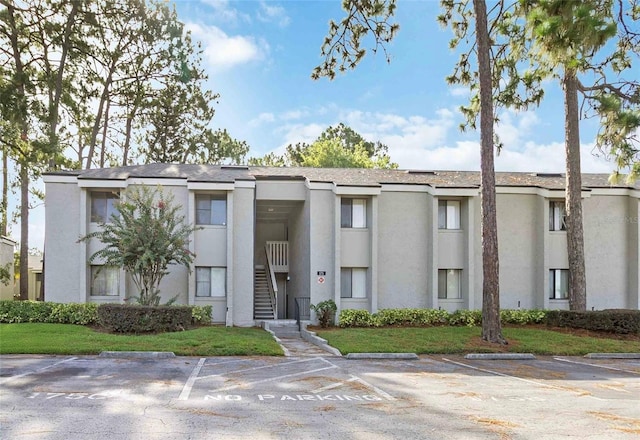 175 Springwood Cir Unit C, Longwood, FL 32750 - view of property featuring uncovered parking and stairs