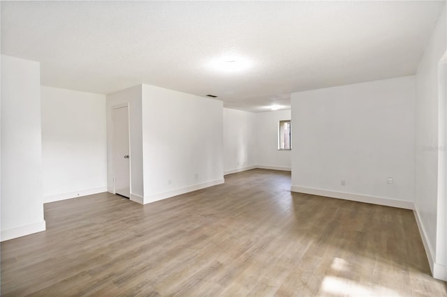 175 Springwood Cir Unit C, Longwood, FL 32750 - empty room featuring wood finished floors and a textured ceiling