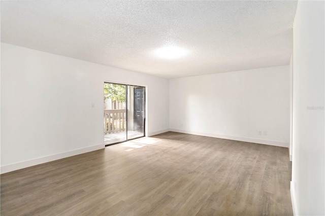 175 Springwood Cir Unit C, Longwood, FL 32750 - empty room with wood finished floors and a textured ceiling