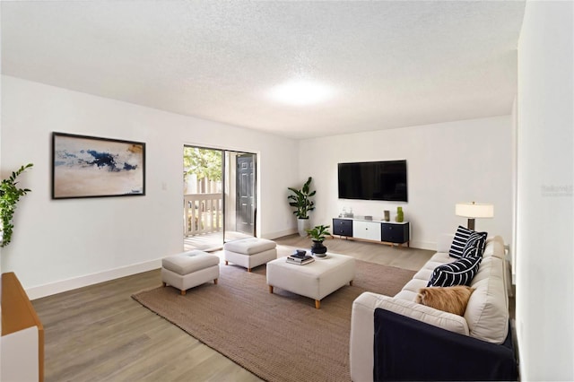 175 Springwood Cir Unit C, Longwood, FL 32750 - living room featuring wood finished floors and a textured ceiling