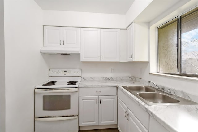 175 Springwood Cir Unit C, Longwood, FL 32750 - kitchen featuring electric range, under cabinet range hood, and white cabinetry