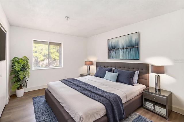 175 Springwood Cir Unit C, Longwood, FL 32750 - bedroom featuring wood finished floors and baseboards